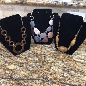 Lot of three earth tone wooden necklaces. Great shape.